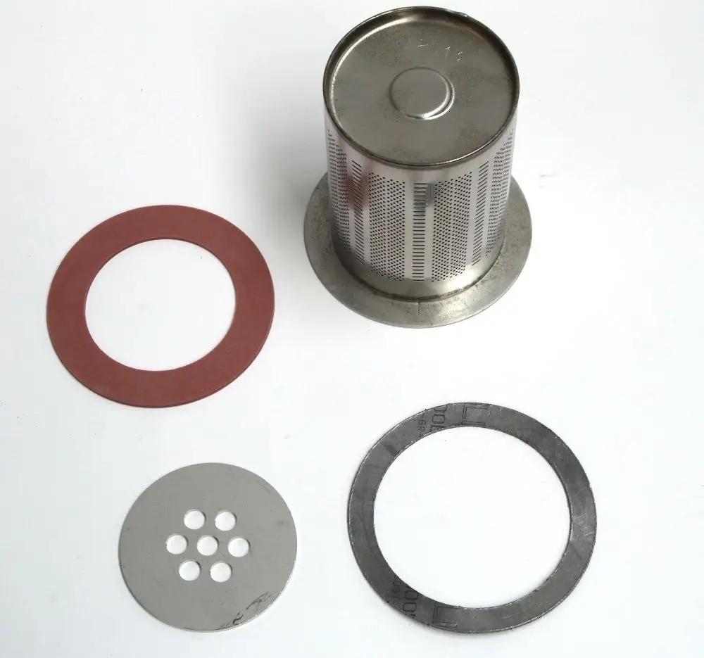 Daikin Brenneroberfläche aus Metall mit verschiedenen Dichtungen und Sieben, geeignet für spezielle Heizgeräte, angeordnet vor neutralem Hintergrund.